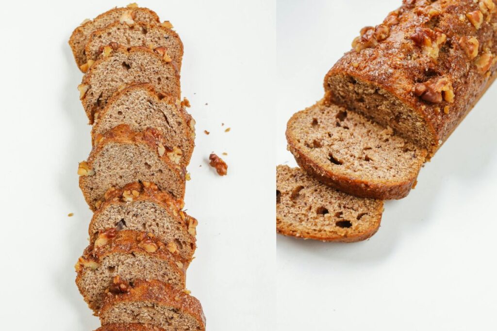 Freshly baked banana bread with walnuts, sliced and ready to serve on a white background.